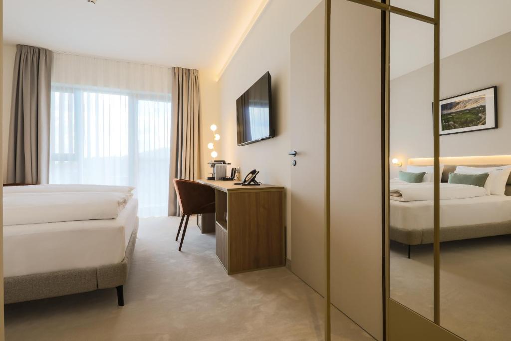 Postel nebo postele na pokoji v ubytování Hotel Essence