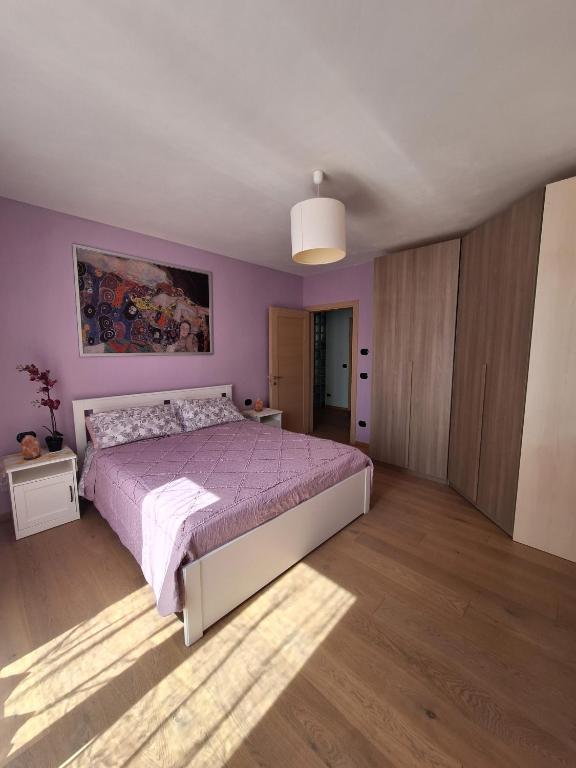 Postel nebo postele na pokoji v ubytování Casa 'Rosa dei laghi'