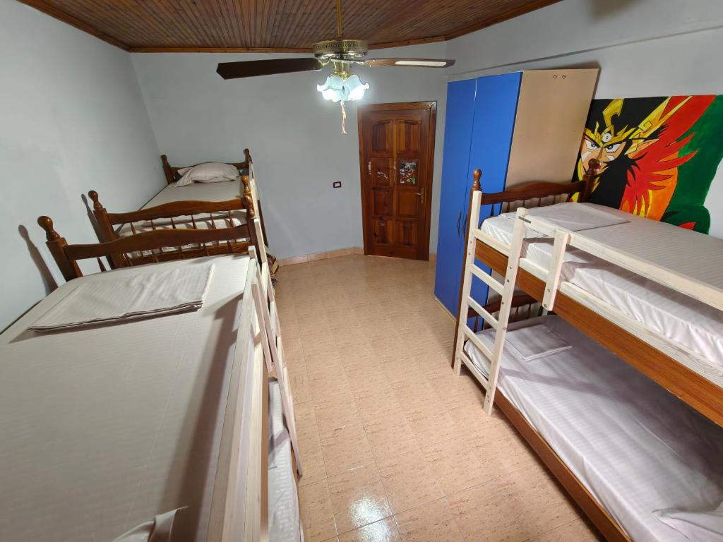 Postel nebo postele na pokoji v ubytování Bliss Inn Hostel & Tours