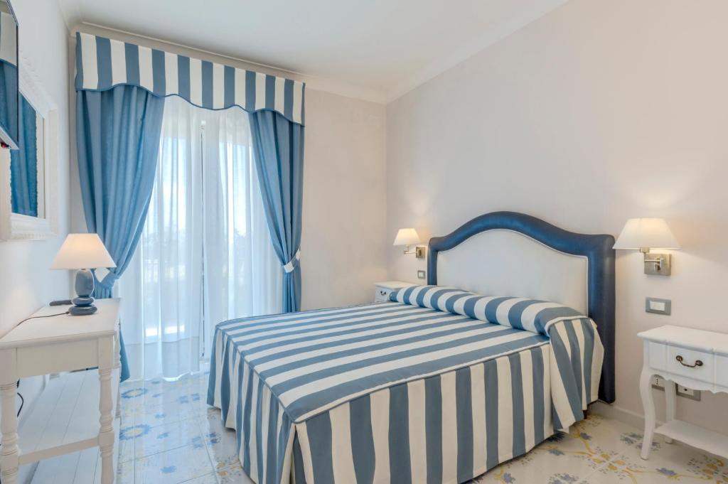 Postel nebo postele na pokoji v ubytování Hotel Ristorante Colleverde