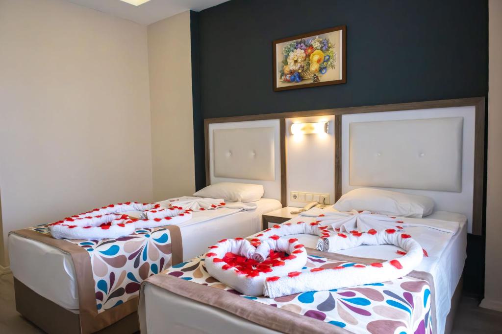 Postel nebo postele na pokoji v ubytování Acar Hotel