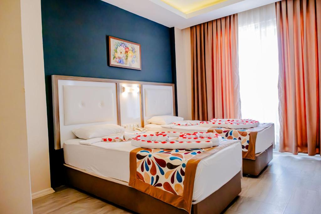 Postel nebo postele na pokoji v ubytování Acar Hotel