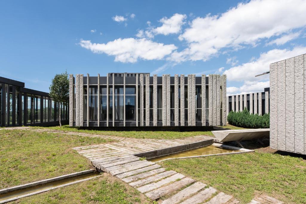 an external view of a large building with glass at Pousada Ribadumia in Ribadumia