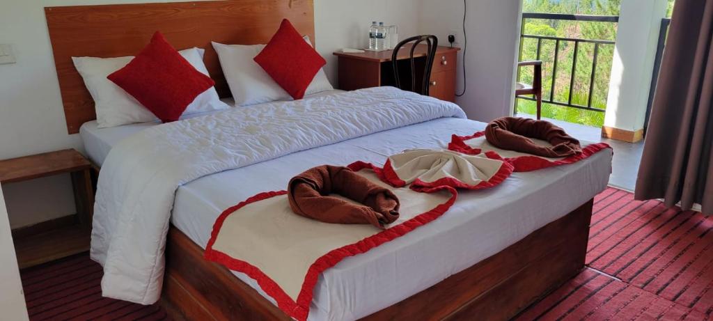 Postel nebo postele na pokoji v ubytování T-More Hotel & Hostel