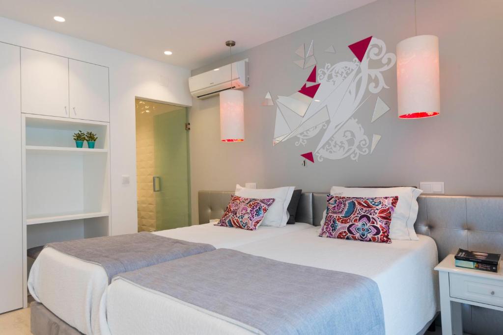 Postel nebo postele na pokoji v ubytování Hotel Magic