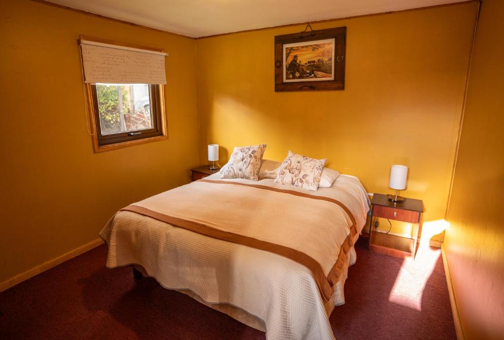Vuode tai vuoteita majoituspaikassa Apart Hotel y Cabañas Valle Exploradores