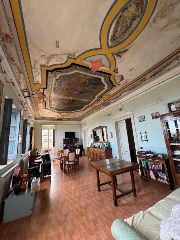 a living room with a painting on the ceiling at Borgo Antico Satriano in Satriano