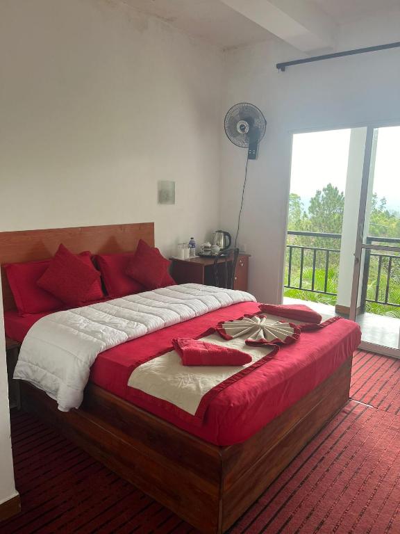 Postel nebo postele na pokoji v ubytování T-More Hotel & Hostel