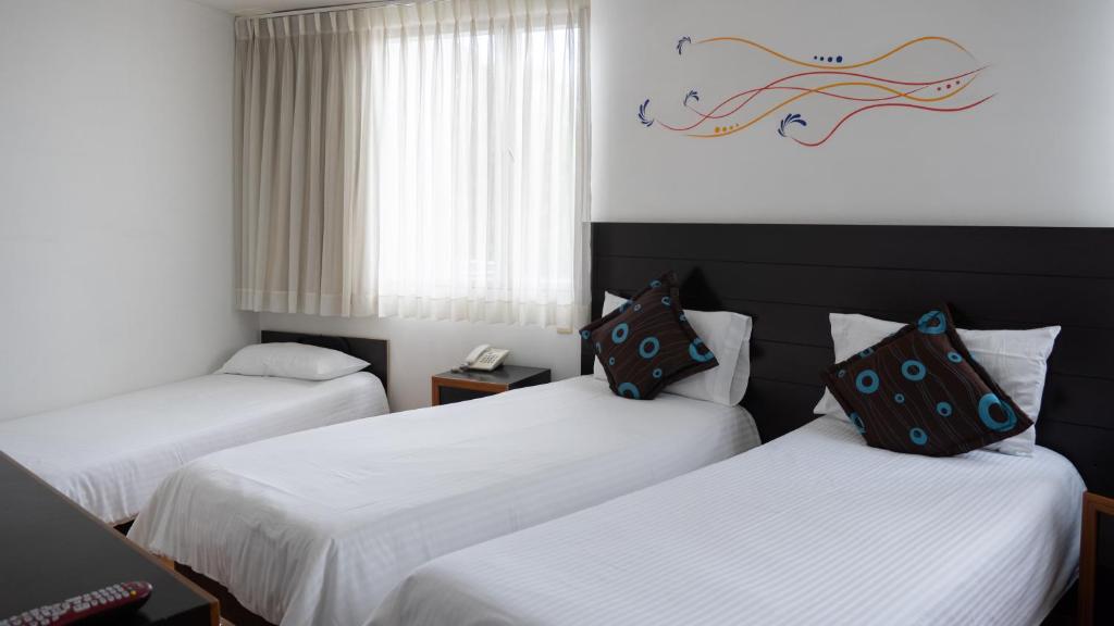 Postel nebo postele na pokoji v ubytování Benidorm Hotel