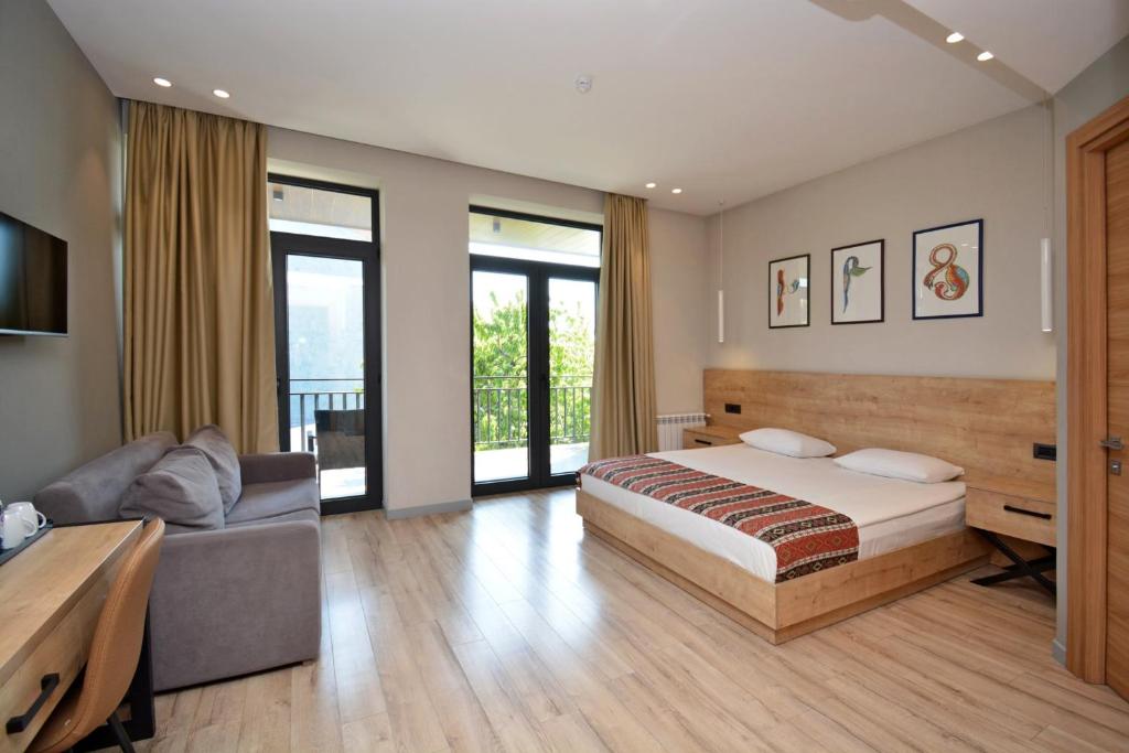 Postel nebo postele na pokoji v ubytování Andor Hotel