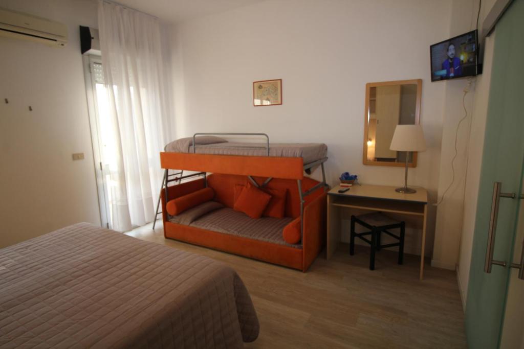 Postel nebo postele na pokoji v ubytování Hotel Firenze