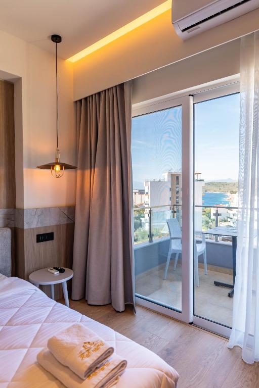 Postel nebo postele na pokoji v ubytování Heksamil Hotel
