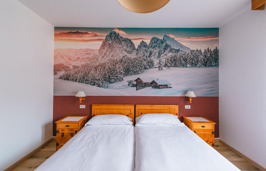Postel nebo postele na pokoji v ubytování Hotel Garnì Rosengarten