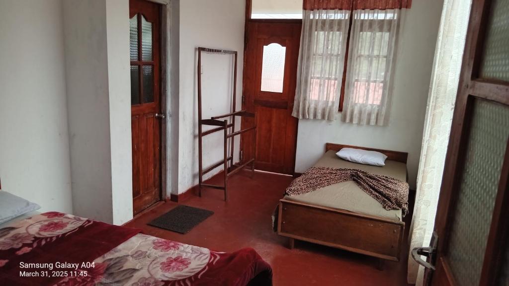 Postel nebo postele na pokoji v ubytování Siloneeds homes