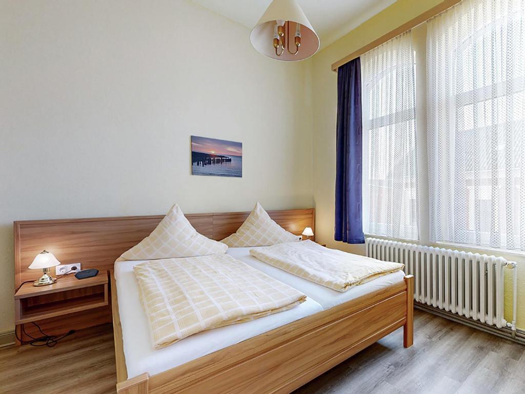 Postel nebo postele na pokoji v ubytování Hotel Graf Waldersee