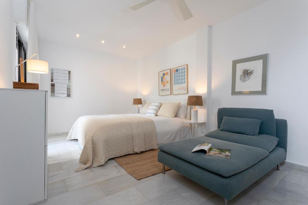 Postel nebo postele na pokoji v ubytování Genteel Home Guadalvillas