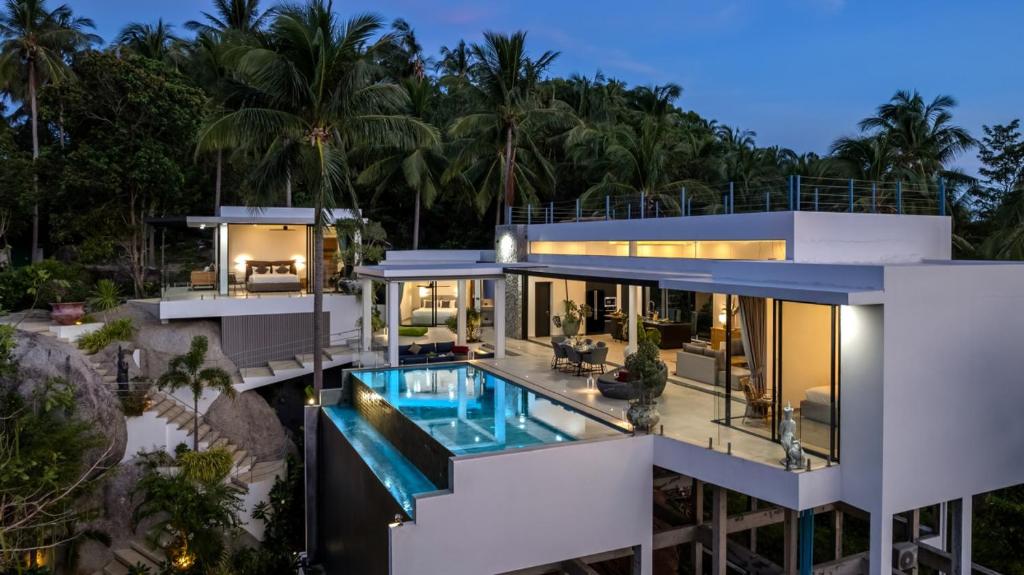 an aerial view of a house with a swimming pool at Villa Bond Seaview Villa in Chaweng Noi Beach