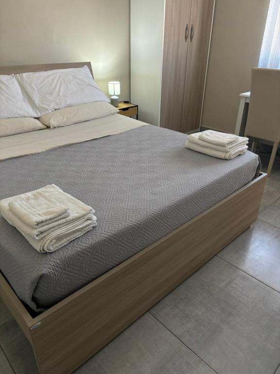 A bed or beds in a room at B&B Alle porte di Caserta