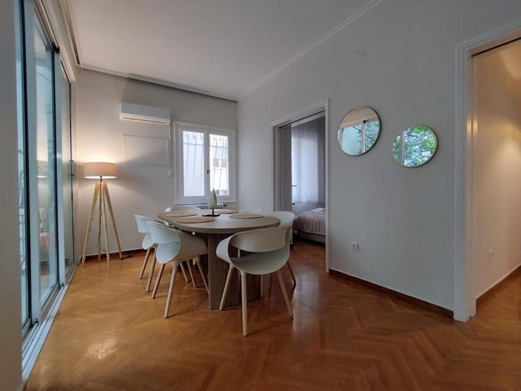 a dining room with a table and chairs at Kolonaki 2 bedroom Flat in Athens
