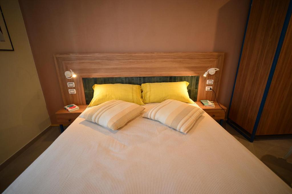 Postel nebo postele na pokoji v ubytování Locanda Parsifal