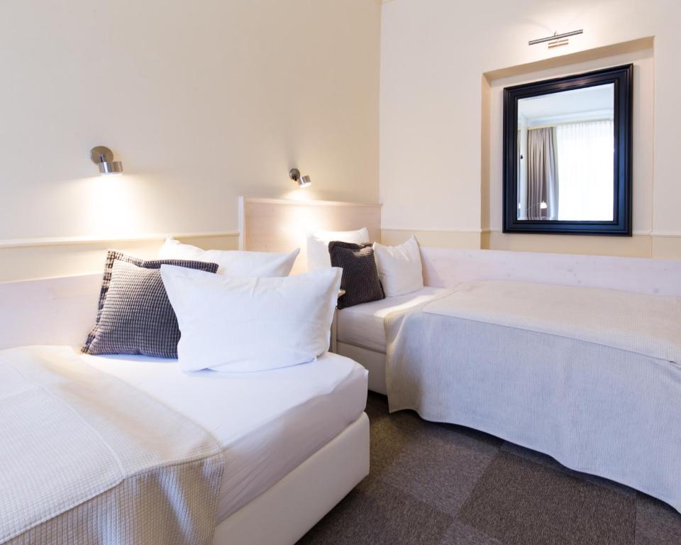Postel nebo postele na pokoji v ubytování Unitas Hotel