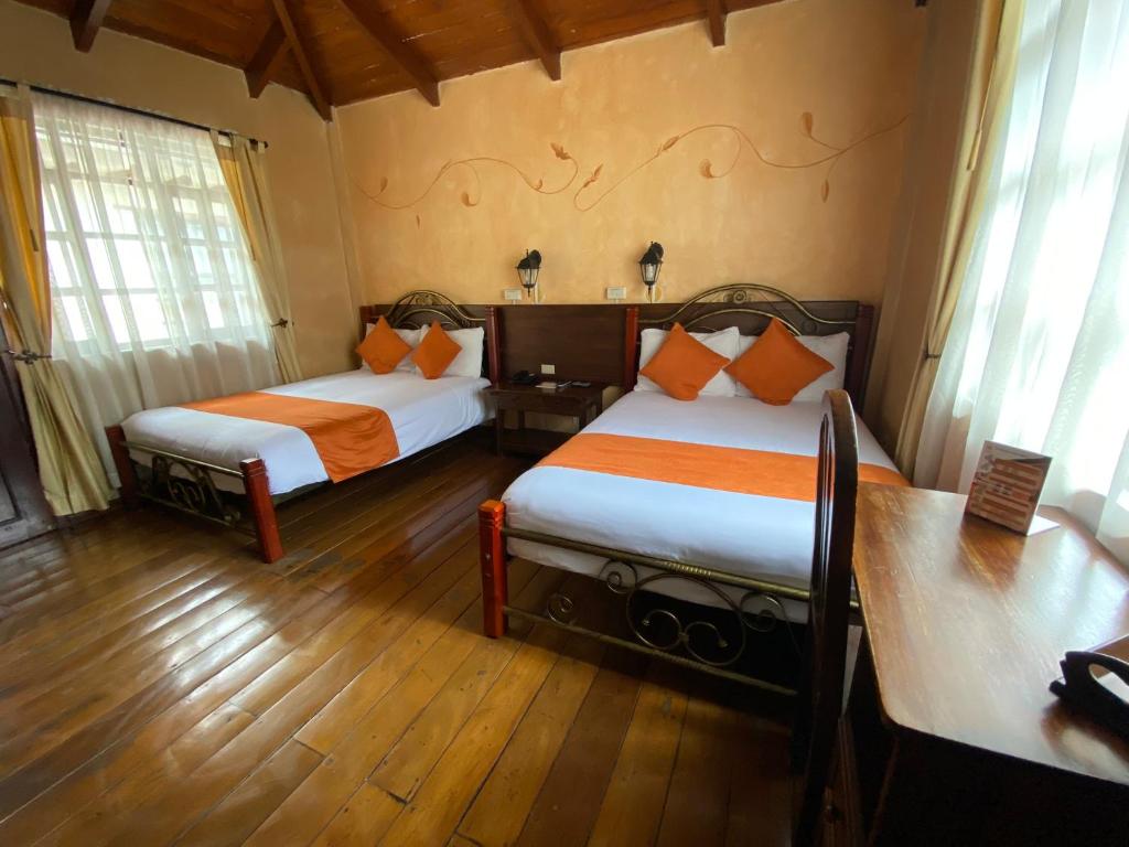 Postel nebo postele na pokoji v ubytování Kituandes Hotel