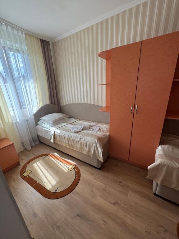 Postel nebo postele na pokoji v ubytování Сонячна Перлина
