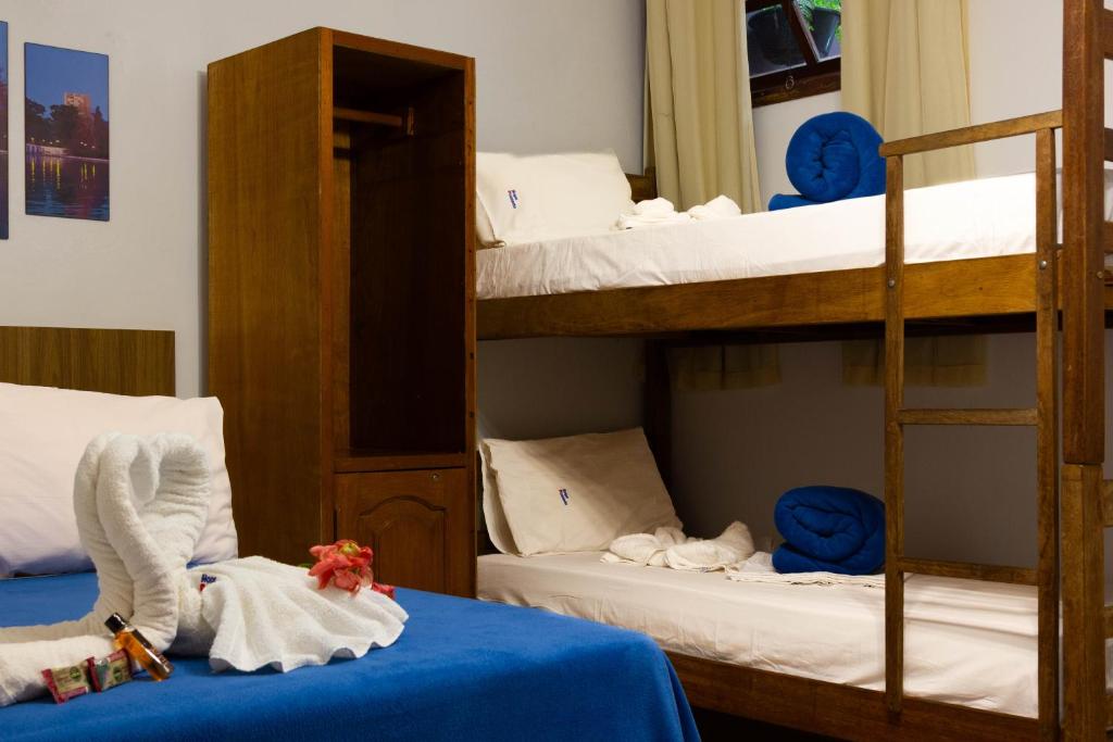 Cama ou camas em um quarto em Hope Pousada