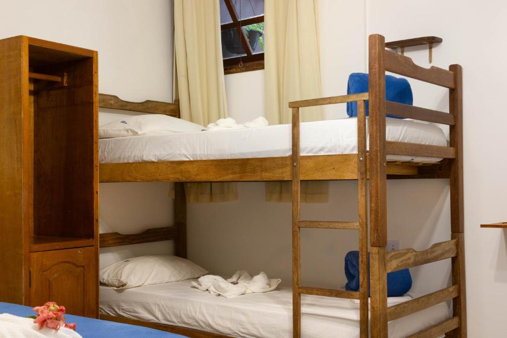 Cama ou camas em um quarto em Hope Pousada