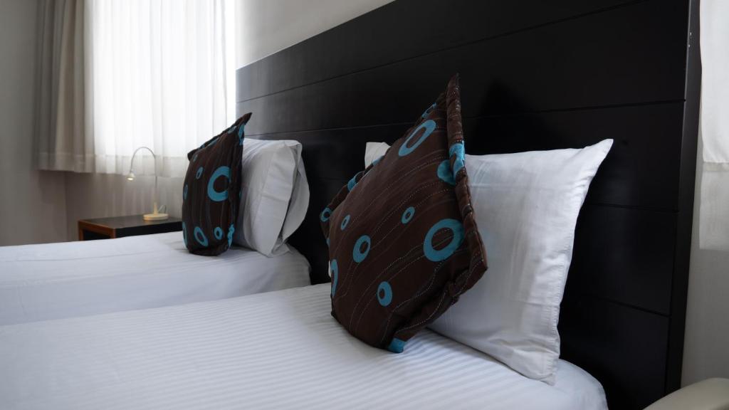 Postel nebo postele na pokoji v ubytování Benidorm Hotel