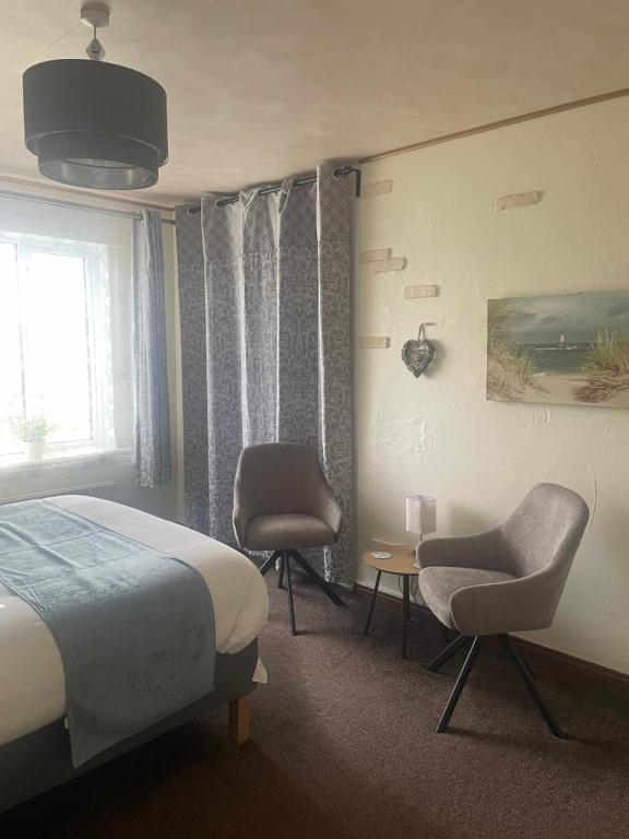 Postel nebo postele na pokoji v ubytování Waterfront Rest B&B