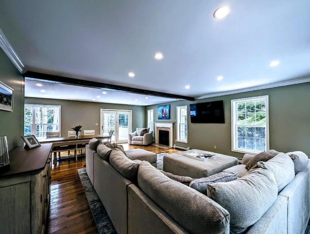 a large living room with couches and a television at Bar Harbor Island Escape in Bar Harbor