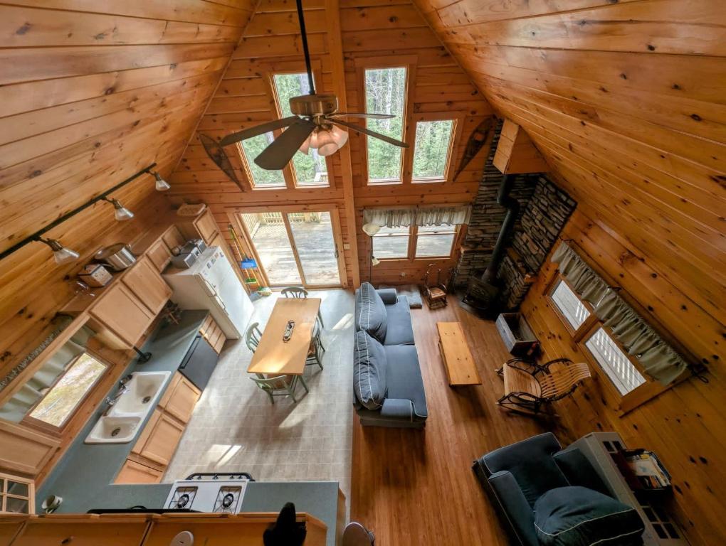 an overhead view of a living room and kitchen in a log cabin at Log Cabin on Saltwater Cove in Ellsworth