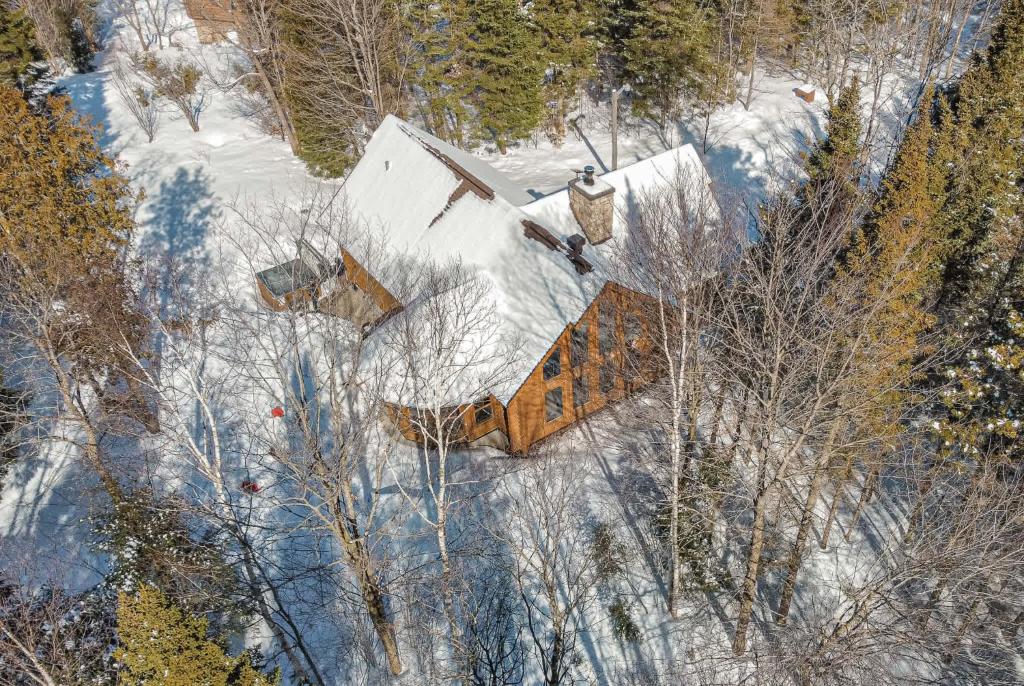 an overhead view of a house covered in snow at Relaxing Sauna and Hot Tub, Near Ski Slopes,Trails in Mille-Isles