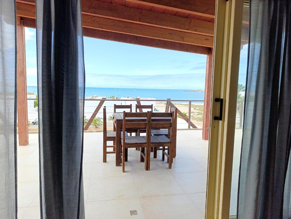 a dining room with a view of the ocean at Boadream Ca' Madeira 2 Attico Linea Prestige in Sal Rei