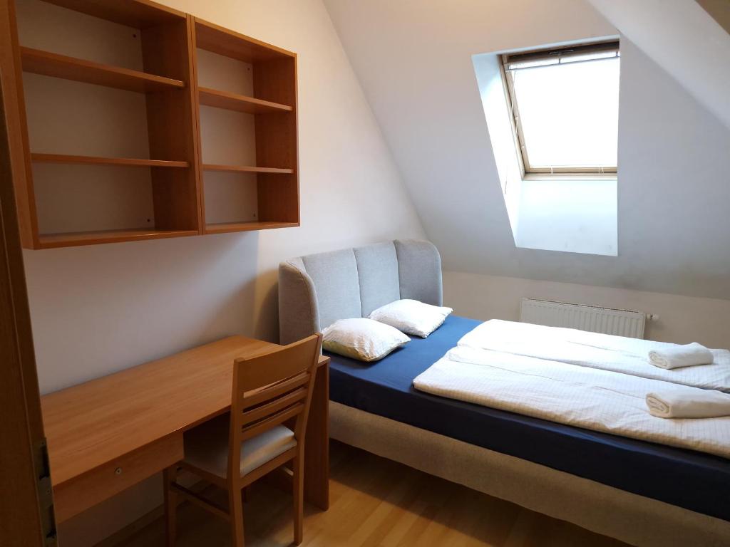 Postel nebo postele na pokoji v ubytování Glinška rooms