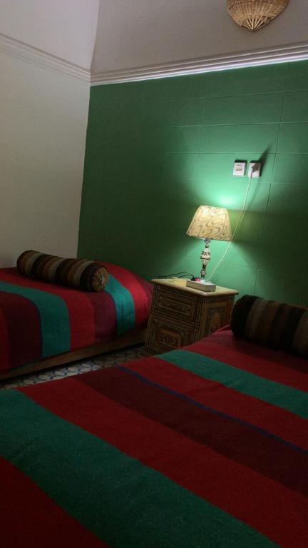 Postel nebo postele na pokoji v ubytování Riad taddert