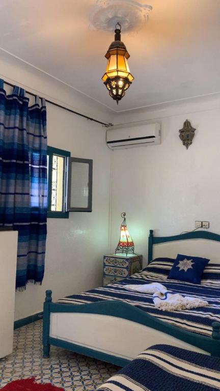 Postel nebo postele na pokoji v ubytování Riad taddert