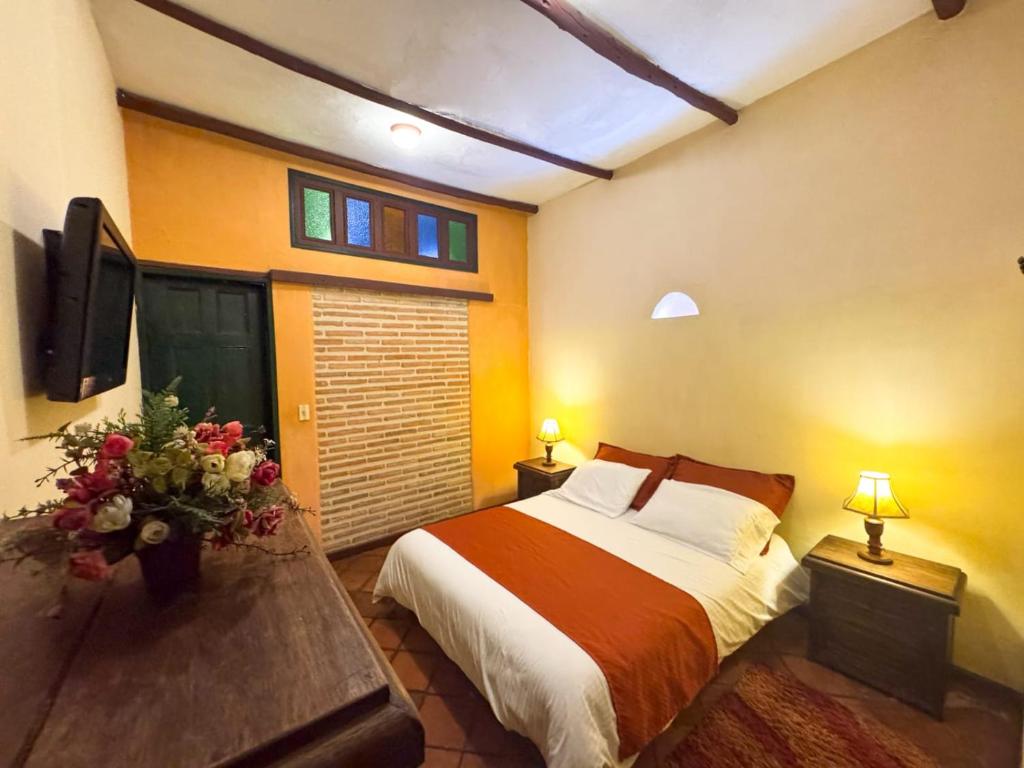 Postel nebo postele na pokoji v ubytování la posada del angel