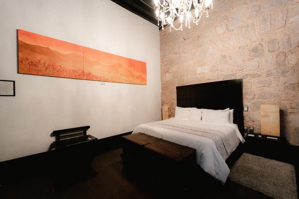 Postel nebo postele na pokoji v ubytování Cantera 10 Hotel Boutique