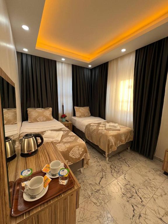 Postel nebo postele na pokoji v ubytování Hotel By Historia