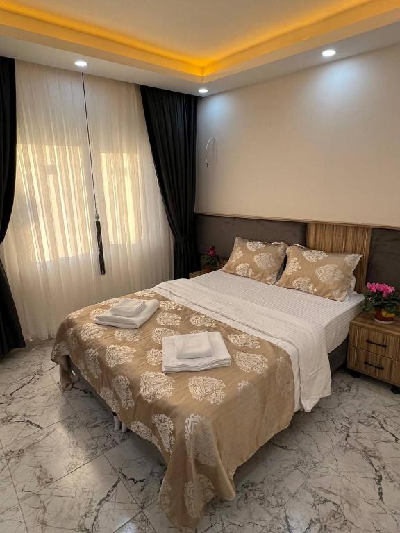 Postel nebo postele na pokoji v ubytování Hotel By Historia