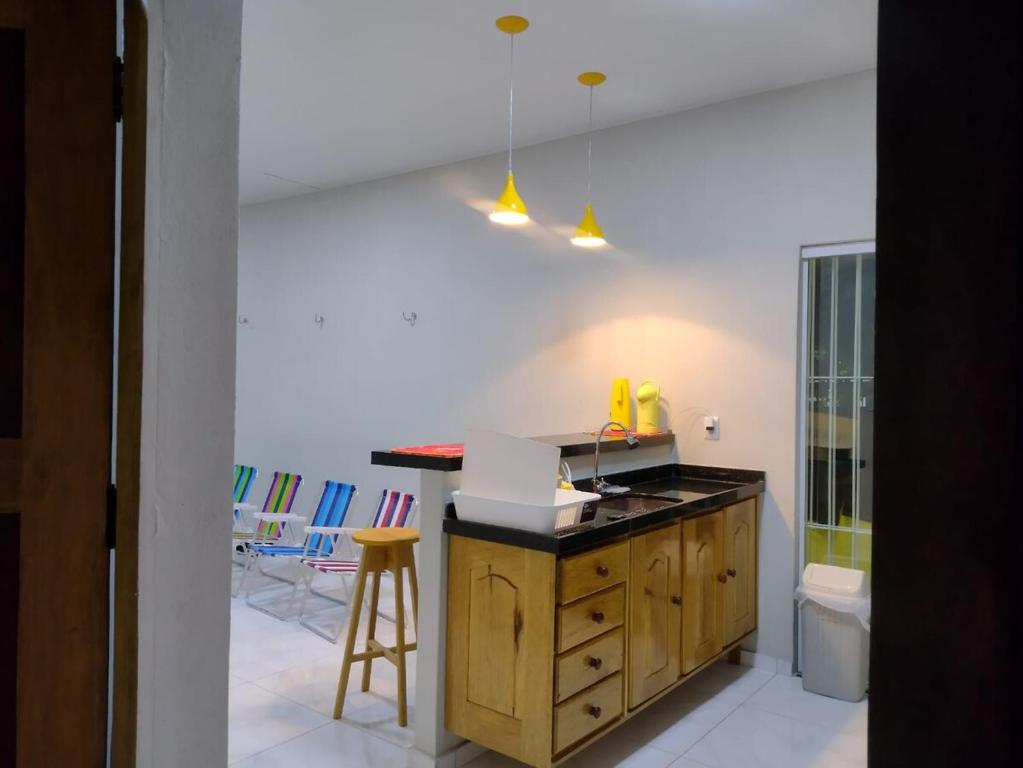 a kitchen with a sink and a counter top at La Fortaleza Marapanim in Marapanim