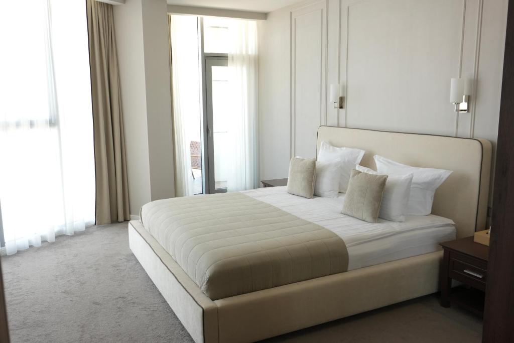 Postel nebo postele na pokoji v ubytování Boutique Hotel Portofino