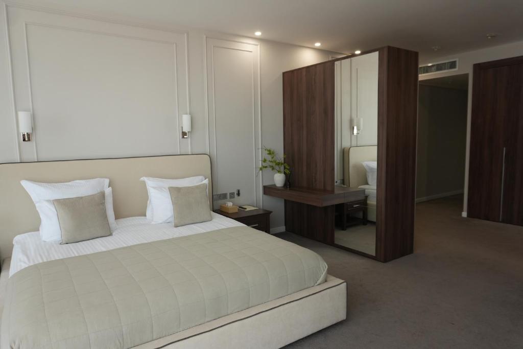 Postel nebo postele na pokoji v ubytování Boutique Hotel Portofino
