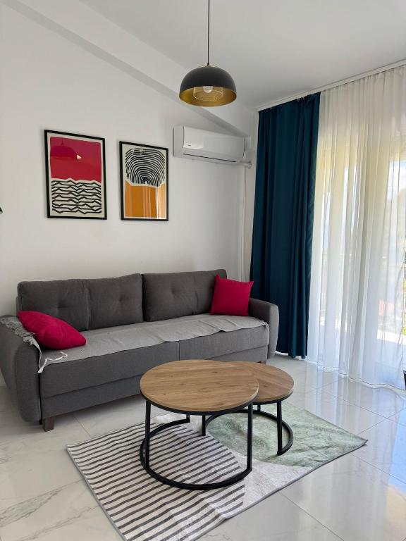 a living room with a couch and a table at Midpoint Sea and Sun in Kotor
