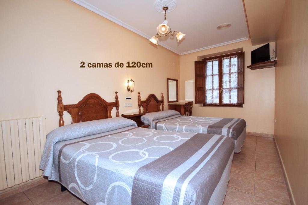 Postel nebo postele na pokoji v ubytování Hotel Ballarin