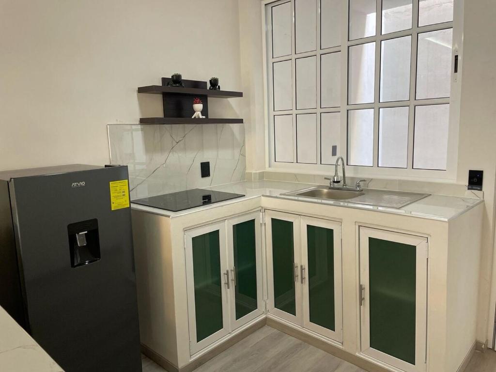 Kuchyň nebo kuchyňský kout v ubytování Apartamento 2 recámaras, smart nuevo