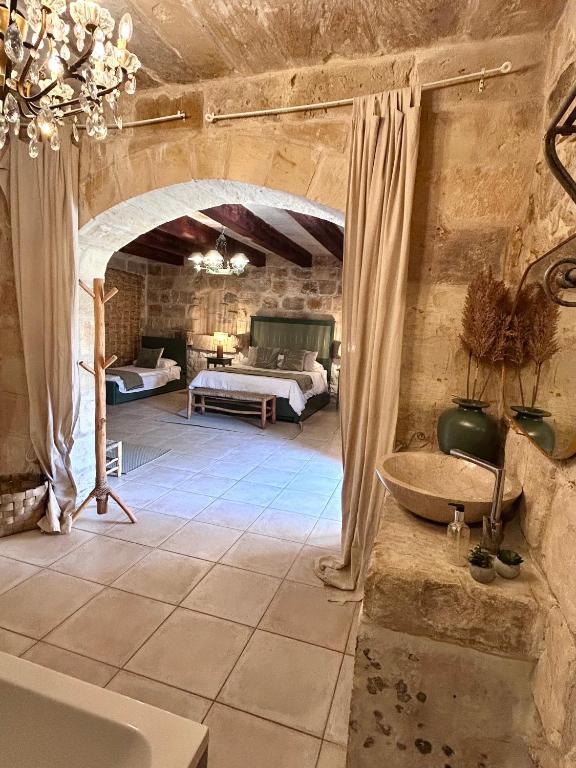 Кровать или кровати в номере Ta Skorba Farmhouse Mgarr