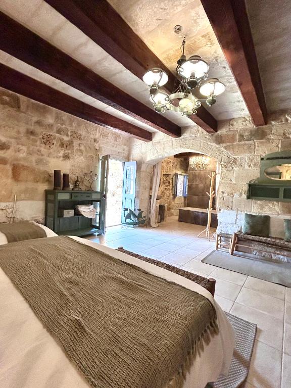 Кровать или кровати в номере Ta Skorba Farmhouse Mgarr